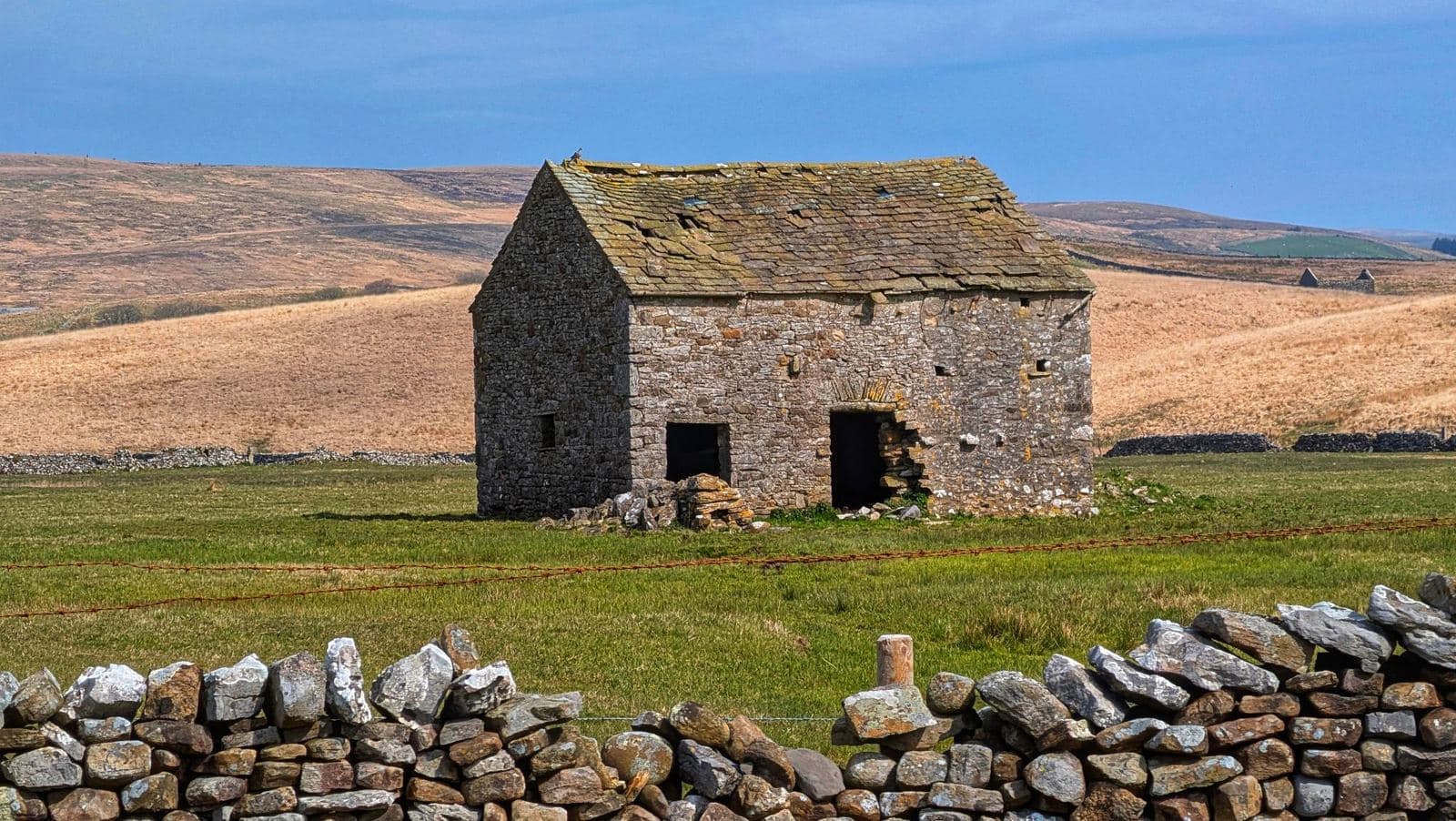 Stone barn in open countryside